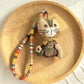 Keypus fabric doll keychain shown next to a set of keys for size reference