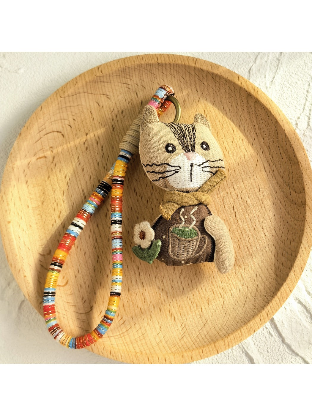 Keypus fabric doll keychain shown next to a set of keys for size reference