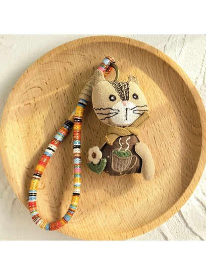 Keypus fabric doll keychain shown next to a set of keys for size reference