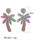 Pair of raffia palm tree shaped earrings hanging from a jewelry stand