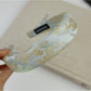 Gifty fabric headband with multicolor flower embroidery laid flat