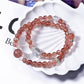 Close-up of Lovra pink crystal beaded bracelet with faceted beads on a white background