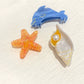Close-up of Beau starfish design on beige claw clip showing textured details