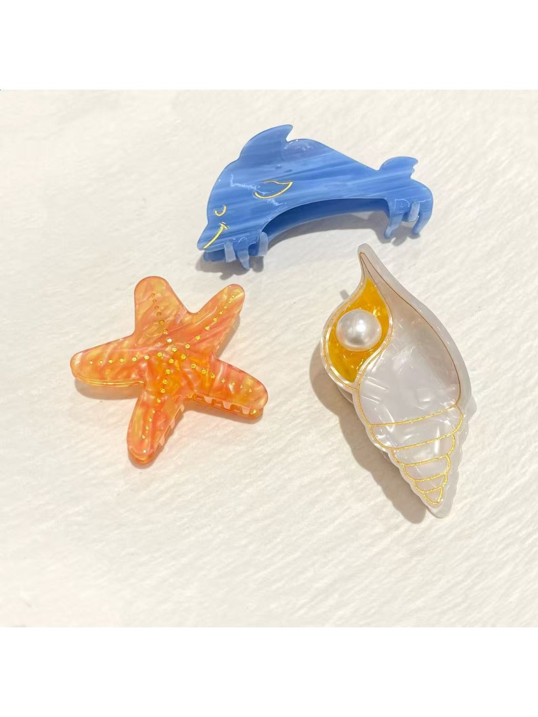 Close-up of Beau starfish design on beige claw clip showing textured details