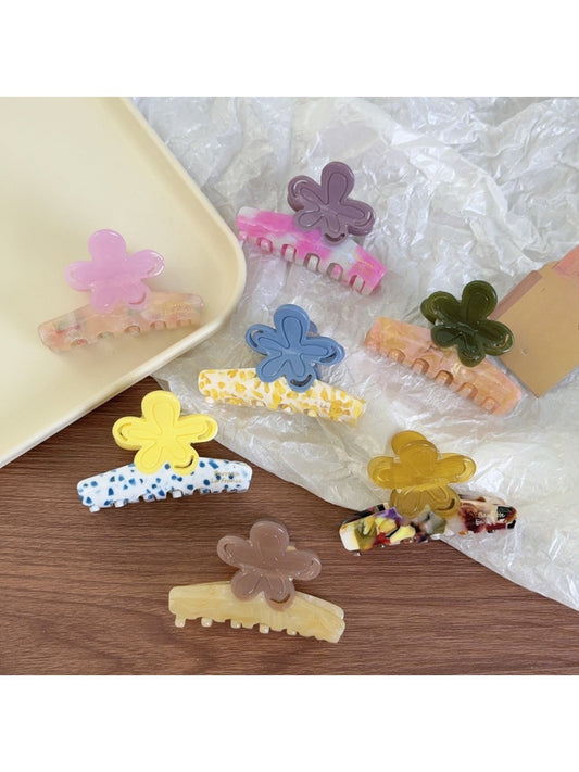 Beau flower shaped claw clip in pastel color block design on white background