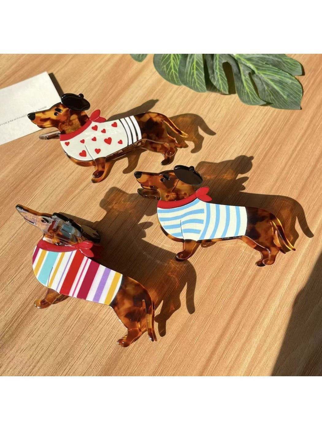 Beau dachshund claw clip held in hand demonstrating size and grip