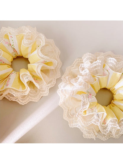 Yellow double layer lace scrunchie displayed flat with visible layers