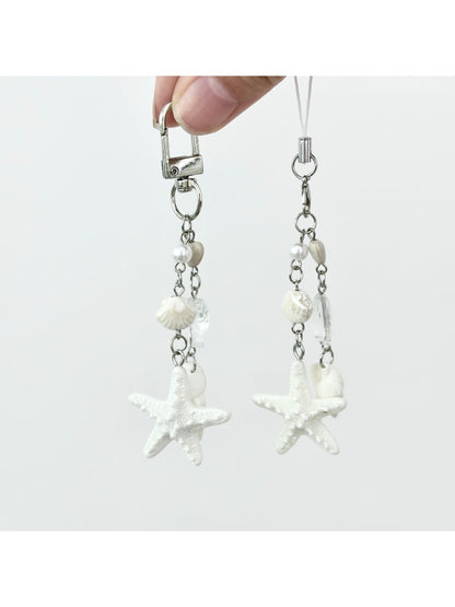 Mini starfish keychain displayed on a wooden surface