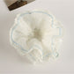 Gifty scrunchie displayed on a white surface highlighting fabric layers