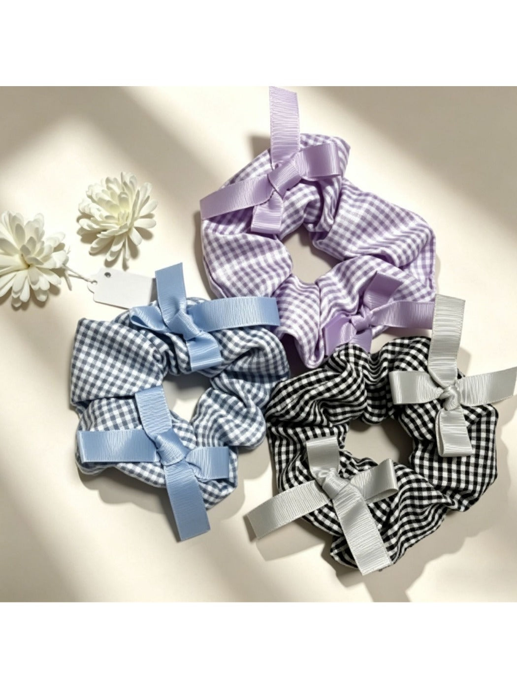 Close-up of Gifty Sweet Bow Embellished Plaid Scrunchie with red and green plaid pattern