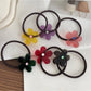 Gifty - Stylish Smiley Face Hair Tie
