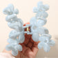 Side view of bright yellow flower hair clip highlighting clip mechanism