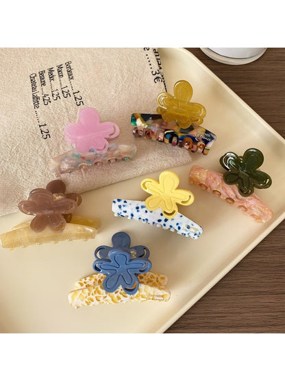 Side view of Beau Half Moon Flower Hair Claw Clip highlighting curved shape and teeth