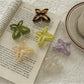 Beau butterfly claw clip open to display inner teeth and clasp