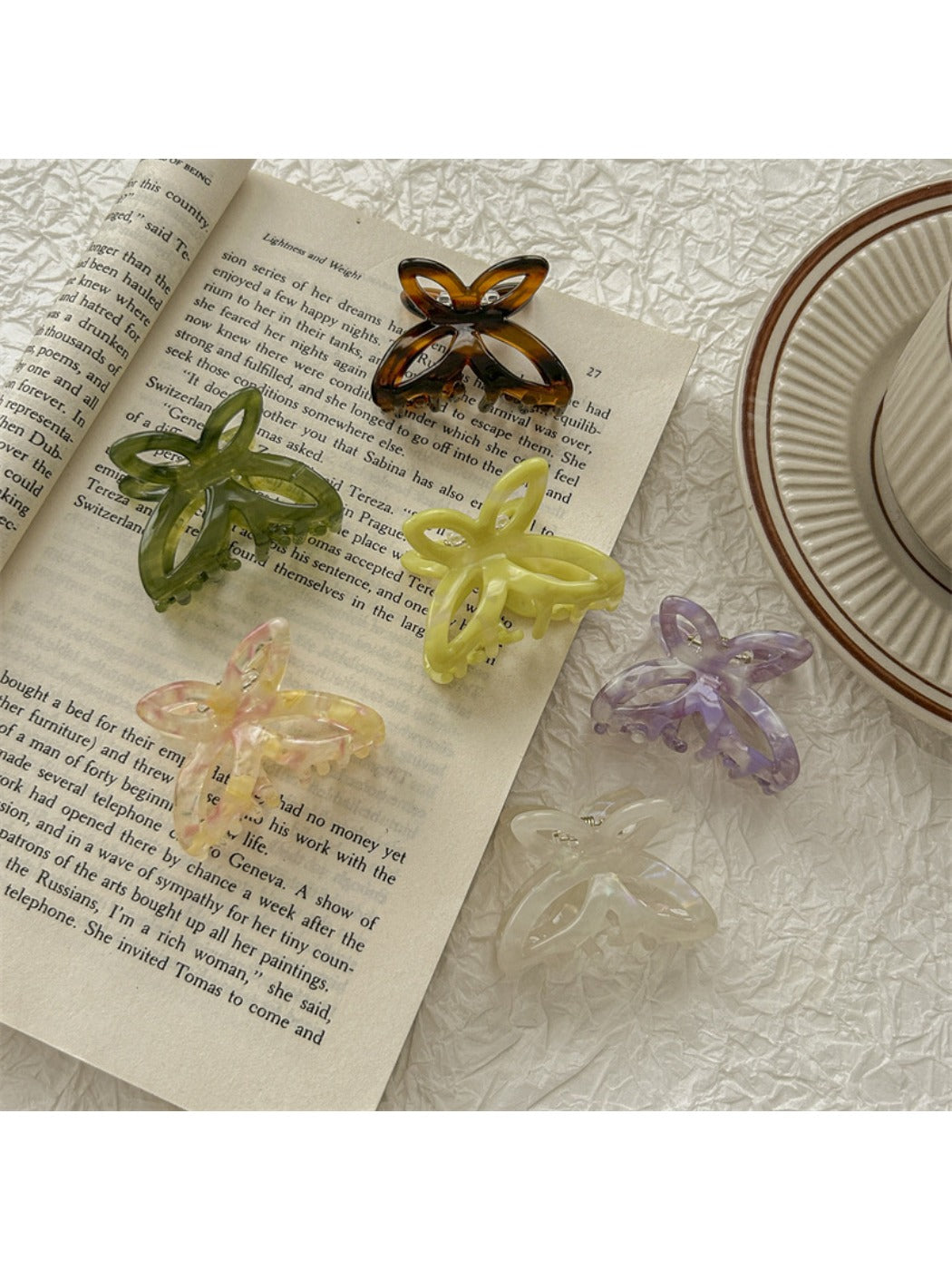 Beau butterfly claw clip open to display inner teeth and clasp