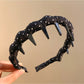 Gifty polka dot headband styled with matching accessories on table