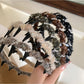 Close-up of Gifty fluffy headband showing plush texture and bow detail