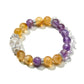 Model wearing Lovra yellow and purple crystal bracelet on wrist