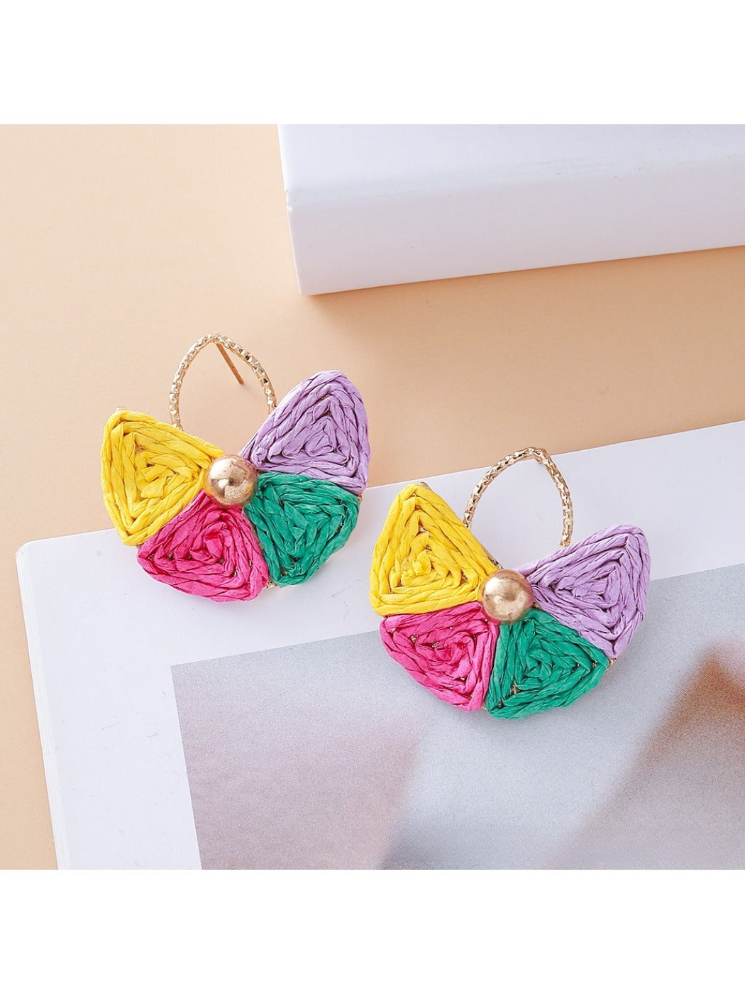 Model wearing vintage fan shaped raffia drop earrings with casual outfit