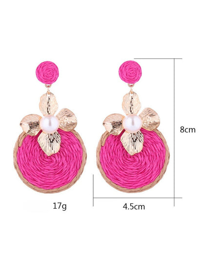 Side view of Earedge circular floral drop earrings highlighting delicate flower details