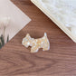 Top view of Beau puppy hair clip showing the full silhouette and acetate pattern
