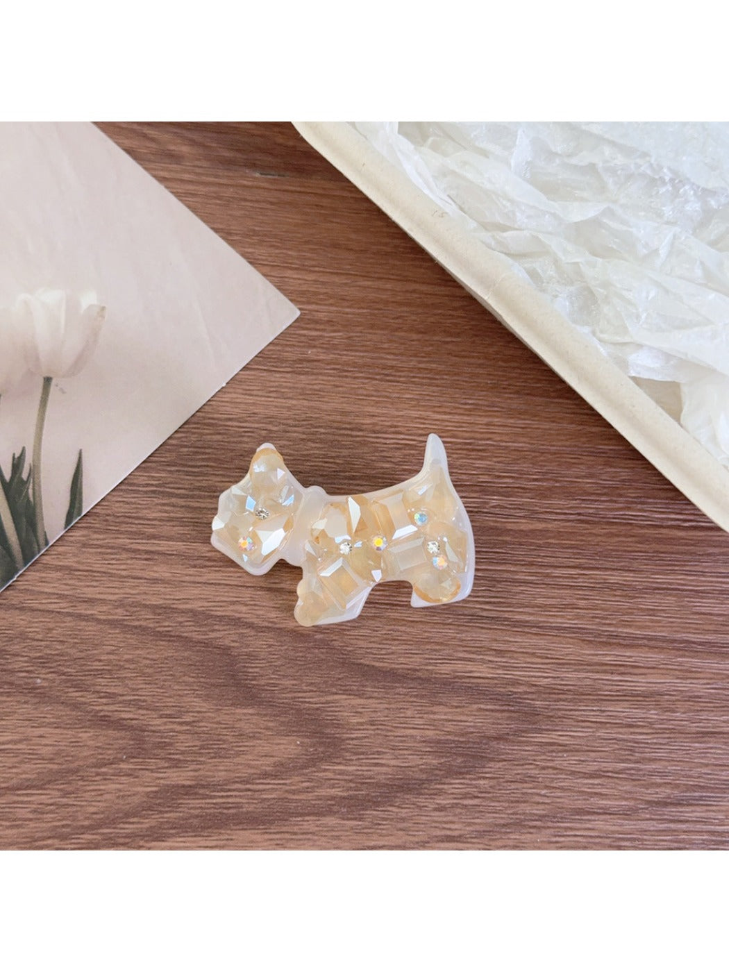 Top view of Beau puppy hair clip showing the full silhouette and acetate pattern