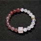 Detailed shot of Lovra bracelet beads arranged in a repeating color block pattern