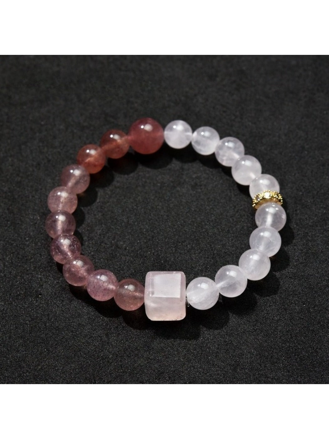 Detailed shot of Lovra bracelet beads arranged in a repeating color block pattern