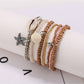 Lovra bracelet with small round gold and silver beads arranged in multiple rows