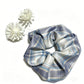 Flat lay of Gifty vintage plaid scrunchie with neutral color palette