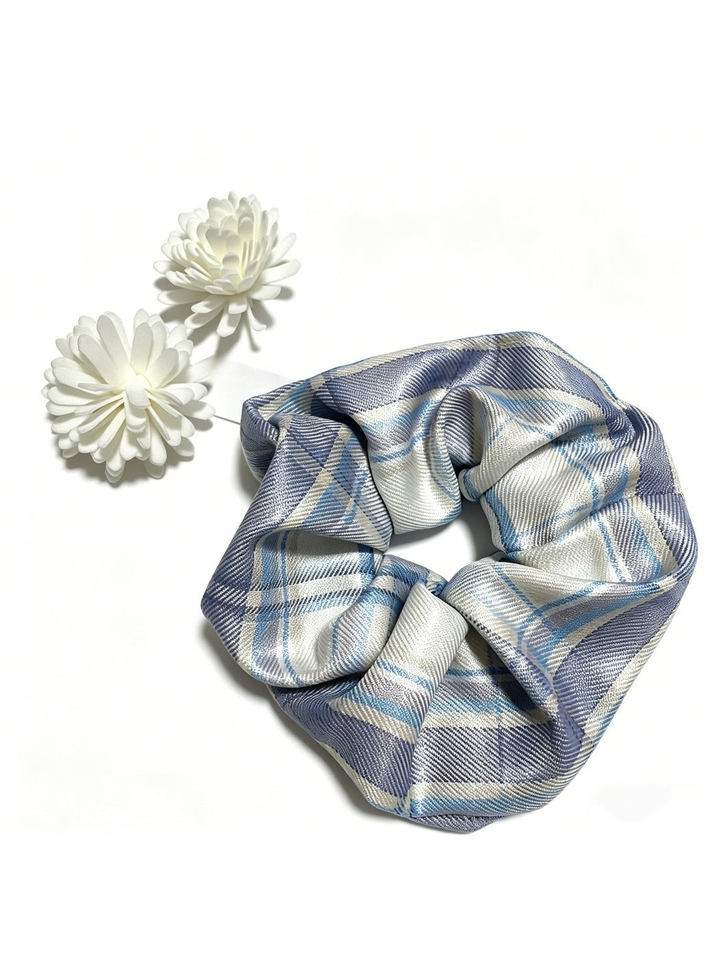 Flat lay of Gifty vintage plaid scrunchie with neutral color palette