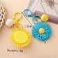 Top view of sunflower keychain showing detailed woven petals and center