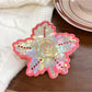 Beau vintage leaf shaped hair claw clip placed on wooden surface with natural light
