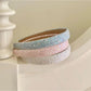 Model wearing Gifty Dreamy Sparkly Sweet Headband with soft pink glitter and bow