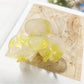 Beau Sweet Acetate Medium Flower Claw Clip with light reflecting off smooth acetate finish