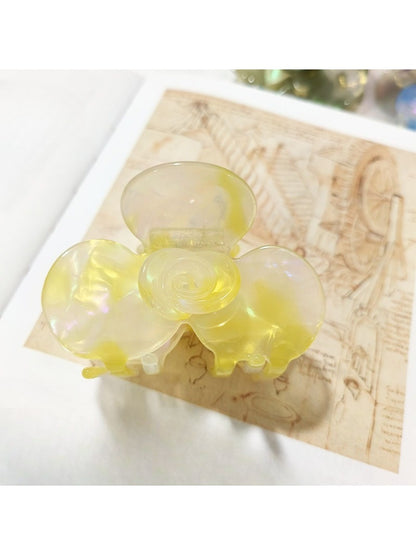 Beau Sweet Acetate Medium Flower Claw Clip with light reflecting off smooth acetate finish