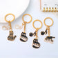 Cartoon cat piano keychain held in hand demonstrating size and portability