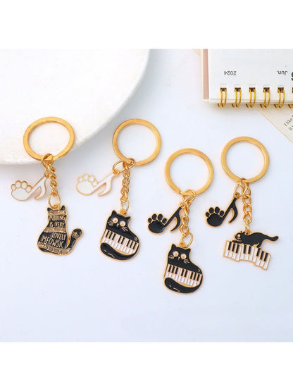 Cartoon cat piano keychain held in hand demonstrating size and portability