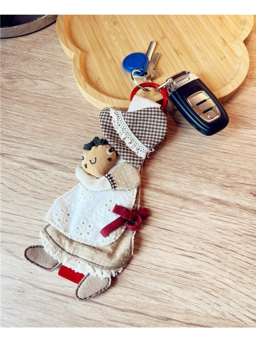 Keypus keychain held in hand, illustrating its lightweight and portable design