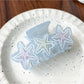 Beau sweet gradient blue claw clip displayed with soft lighting emphasizing color transition