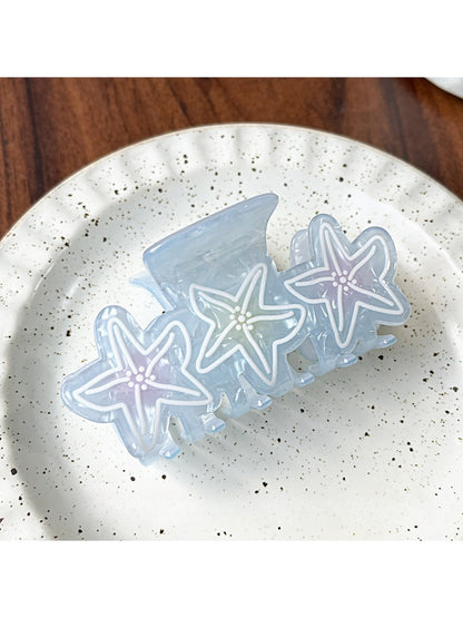 Beau sweet gradient blue claw clip displayed with soft lighting emphasizing color transition