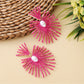 Detailed shot of raffia weave pattern on drop earrings