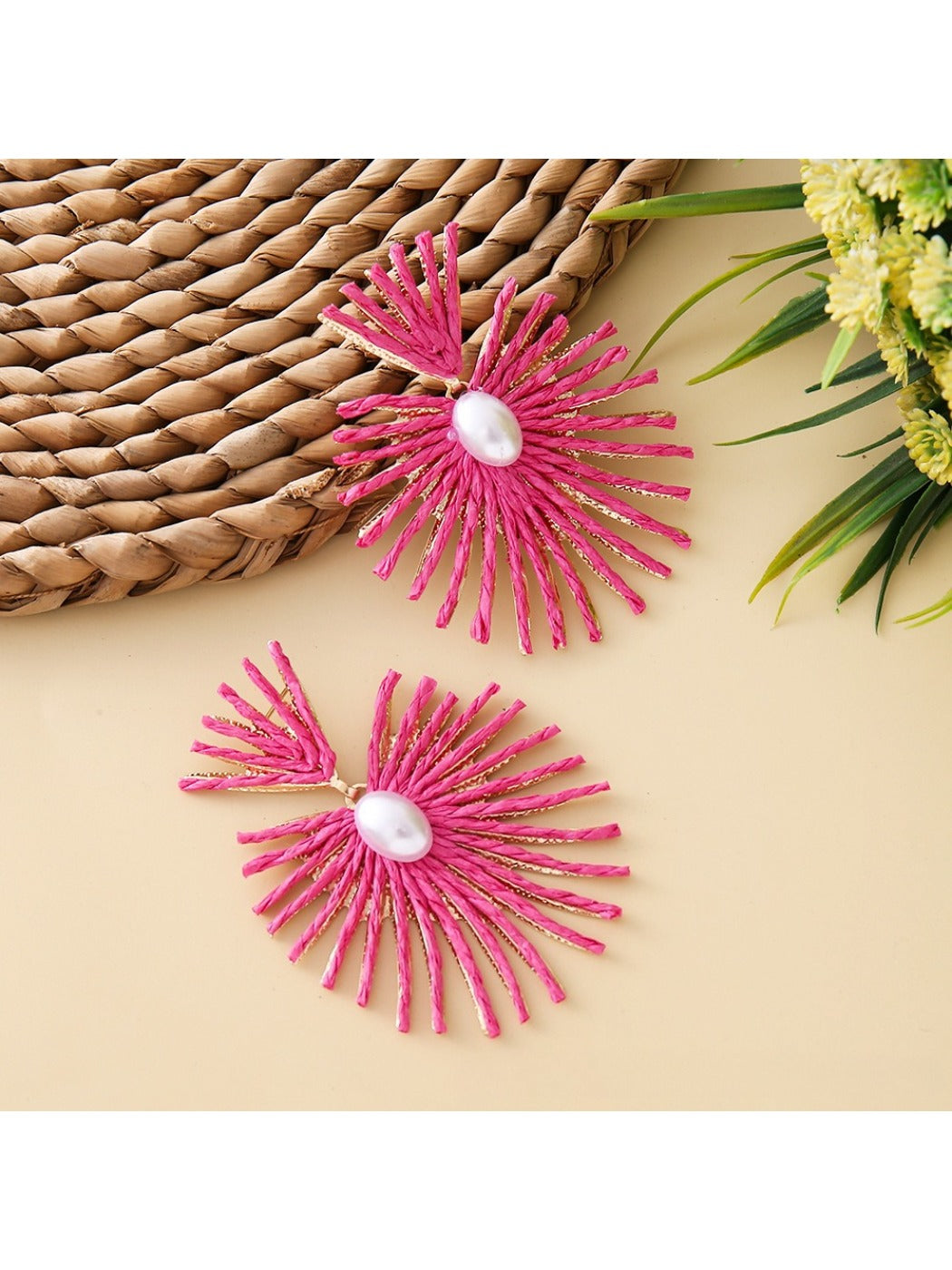 Detailed shot of raffia weave pattern on drop earrings