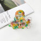 Beau vintage double flower hair claw clip held in hand showing size and scale