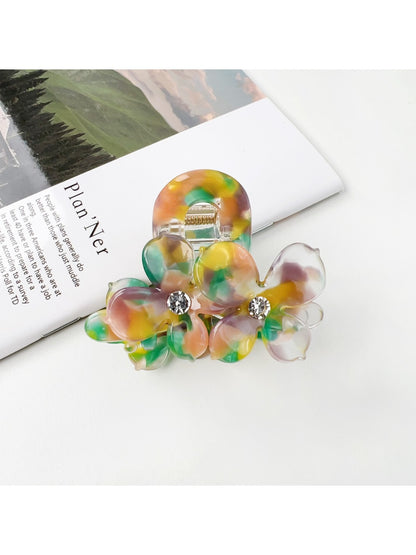Beau vintage double flower hair claw clip held in hand showing size and scale