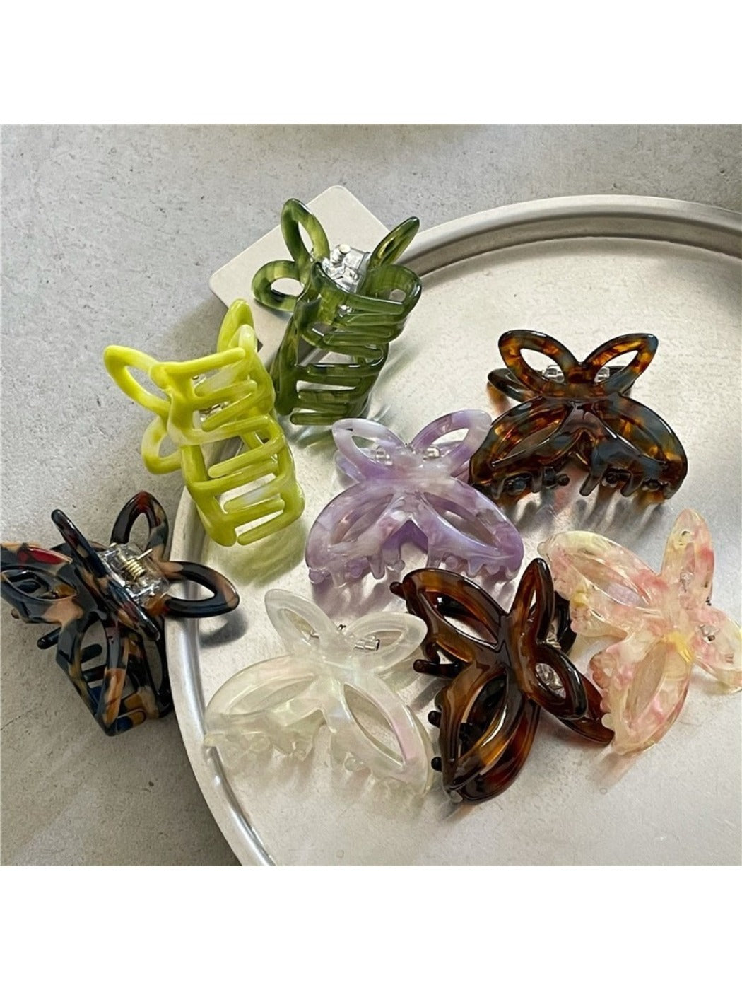 Side view of Beau Misty Acetate Butterfly Hair Clip displaying butterfly shape and clasp