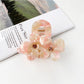 Beau vintage double flower hair claw clip with focus on floral texture and finish