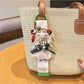 Keypus cute girl charm keychain held in hand showing size and details