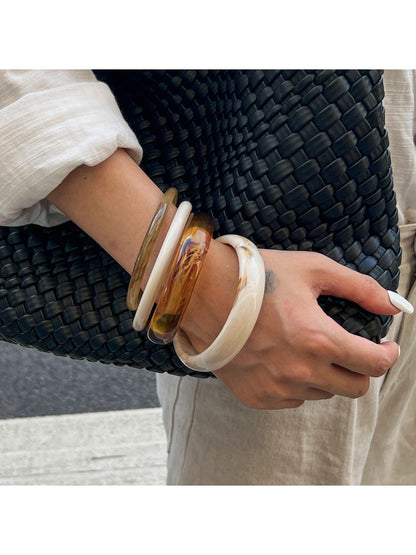 Close-up of Lovra vintage ombre bangle bracelet highlighting smooth gradient finish