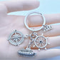 Close-up of alloy steamship shaped keychain with detailed deck and smokestacks